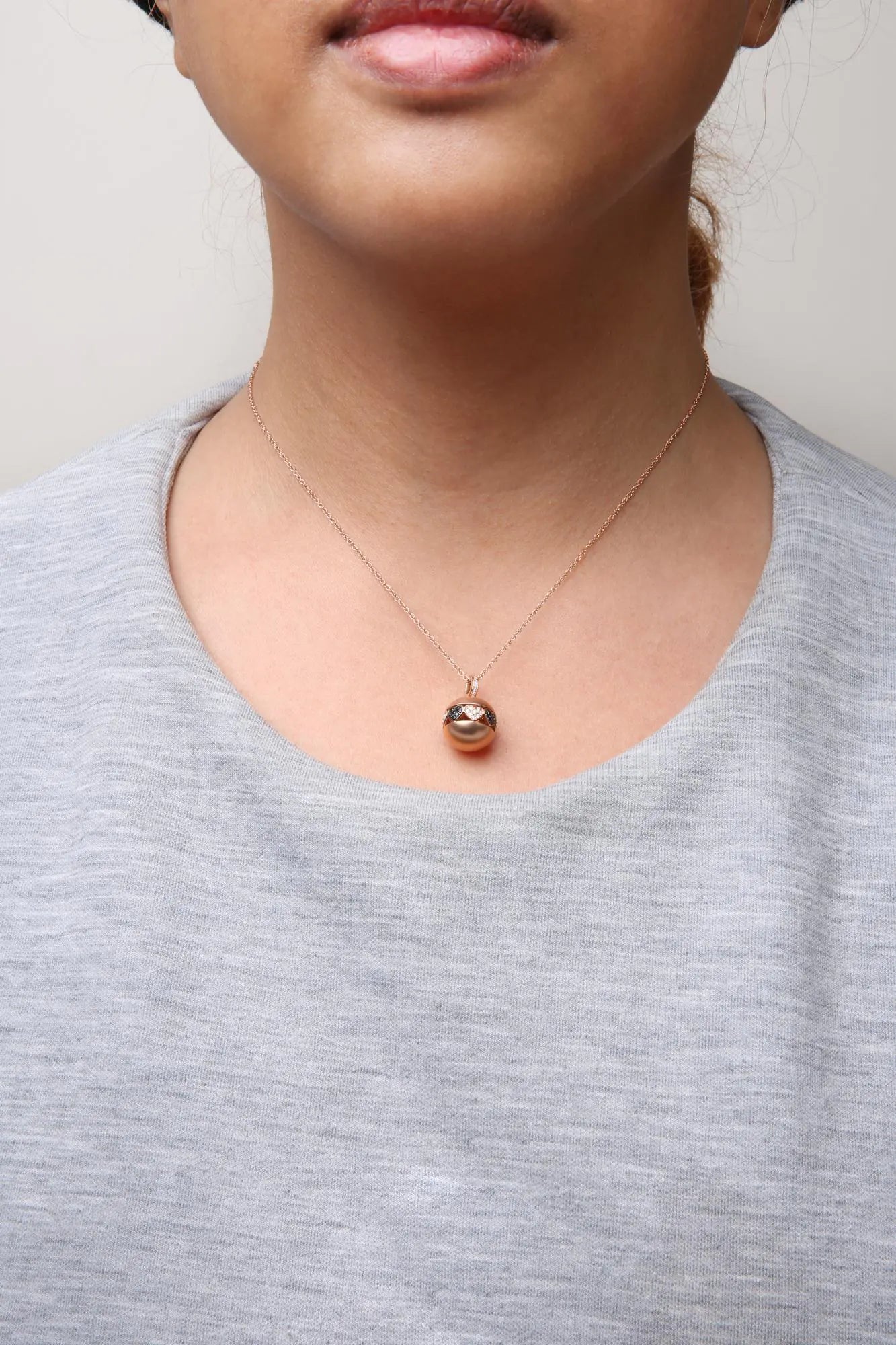 Rose Gold Black-and-White Diamond Ball with Filigree Heart-and-Cluster Design Pendant Necklace